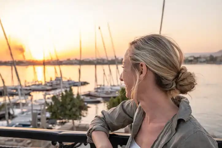A female tourist enjoying Nile view A female tourist enjoying Nile view