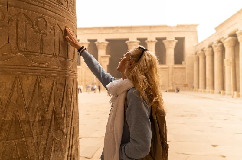 A woman touching Egyptian Hieroglyphics A woman touching Egyptian Hieroglyphics